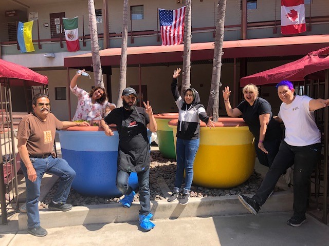 Staff and students who helped paint the giant pots